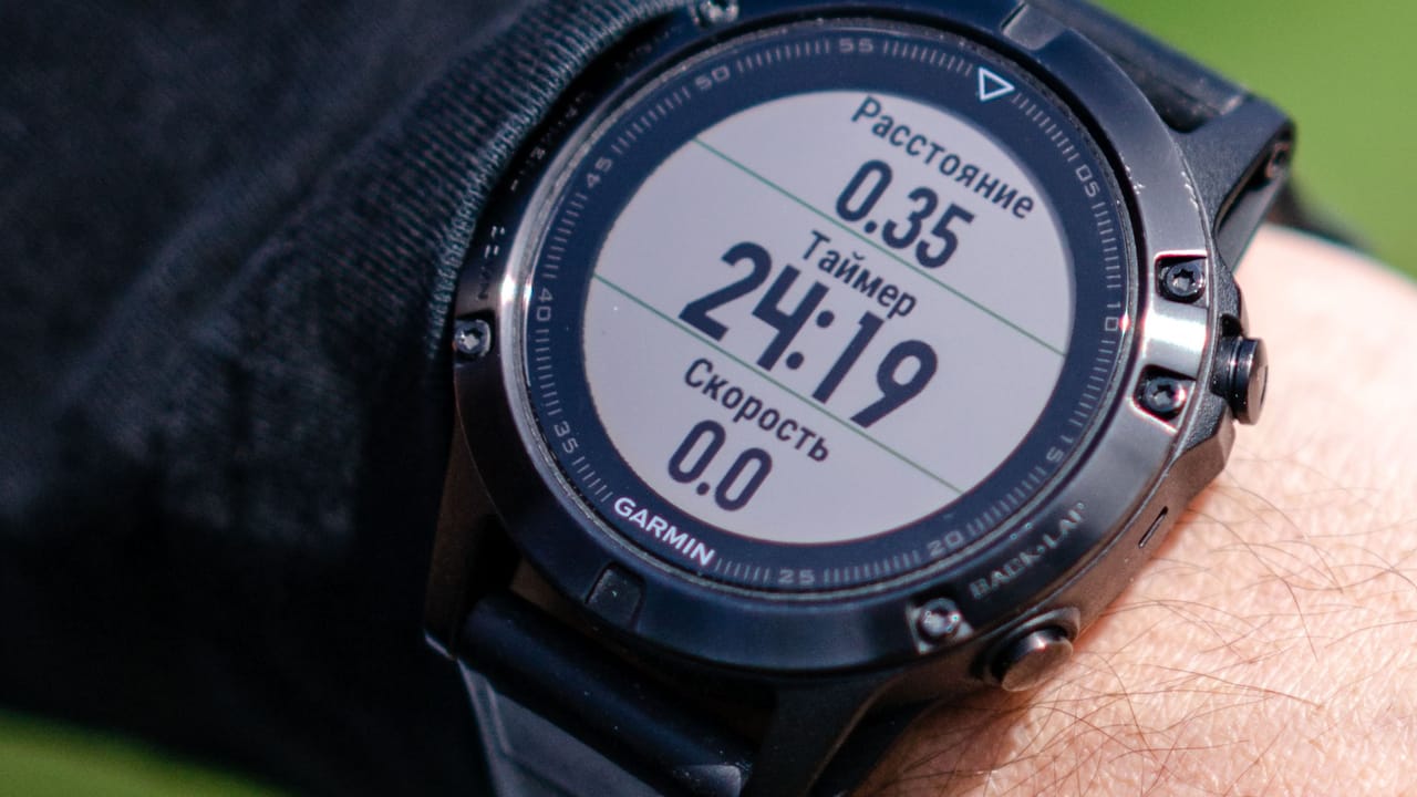 A transflective watch display in daylight, showing distance and pace